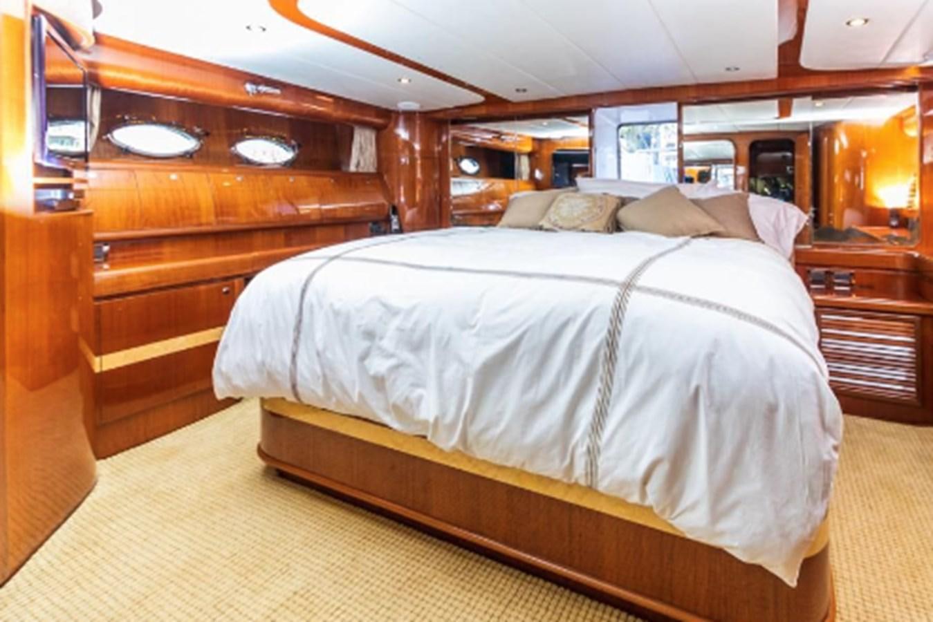 a bed in a room aboard THE FLYING WASP Yacht for Sale