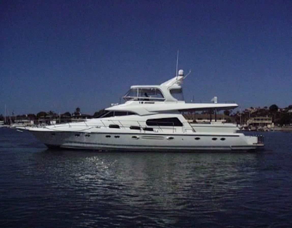 a white yacht on the water aboard JOHNSON 70' FLYBRIDGE M/Y Yacht for Sale