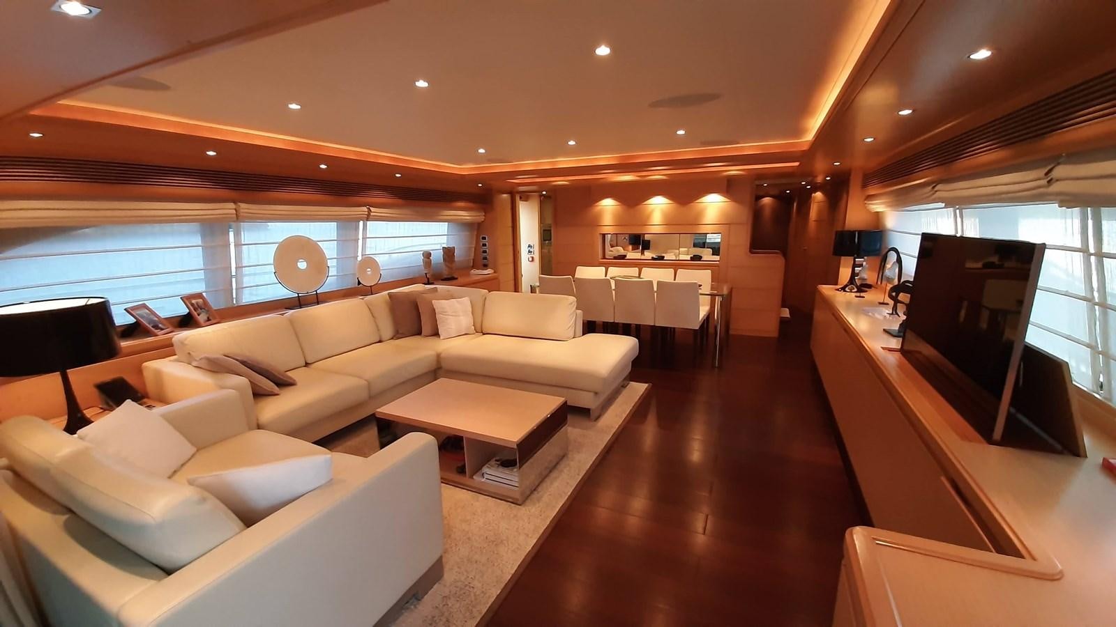 a living room with a large window aboard OKAMI Yacht for Sale