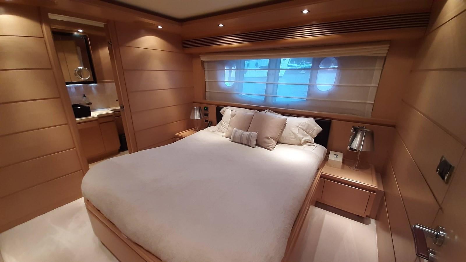 a bed in a room aboard OKAMI Yacht for Sale