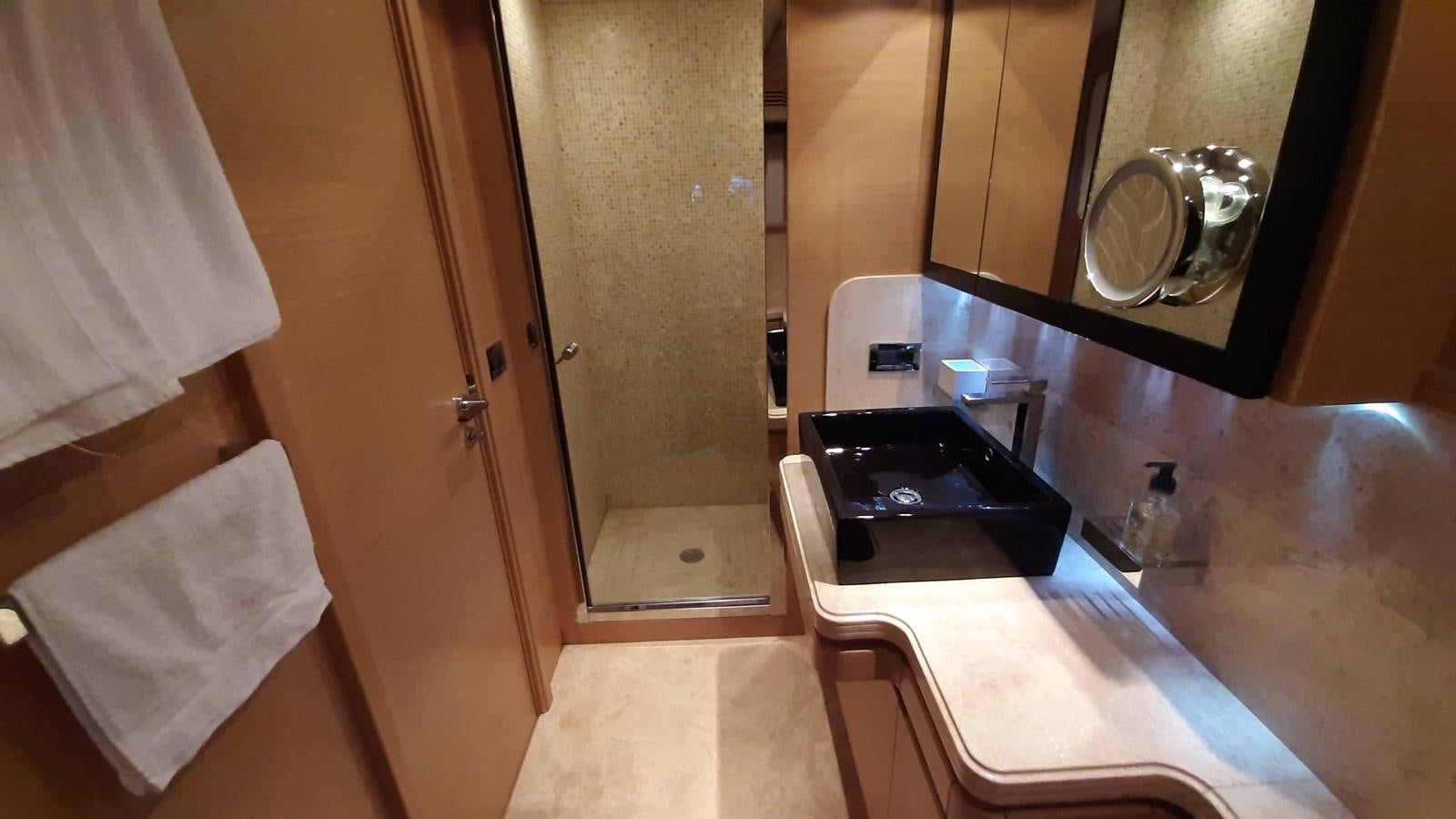 a bathroom with a sink and a mirror aboard OKAMI Yacht for Sale