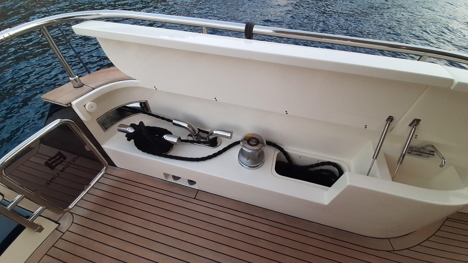 a white bathtub with a sink and a faucet aboard OKAMI Yacht for Sale