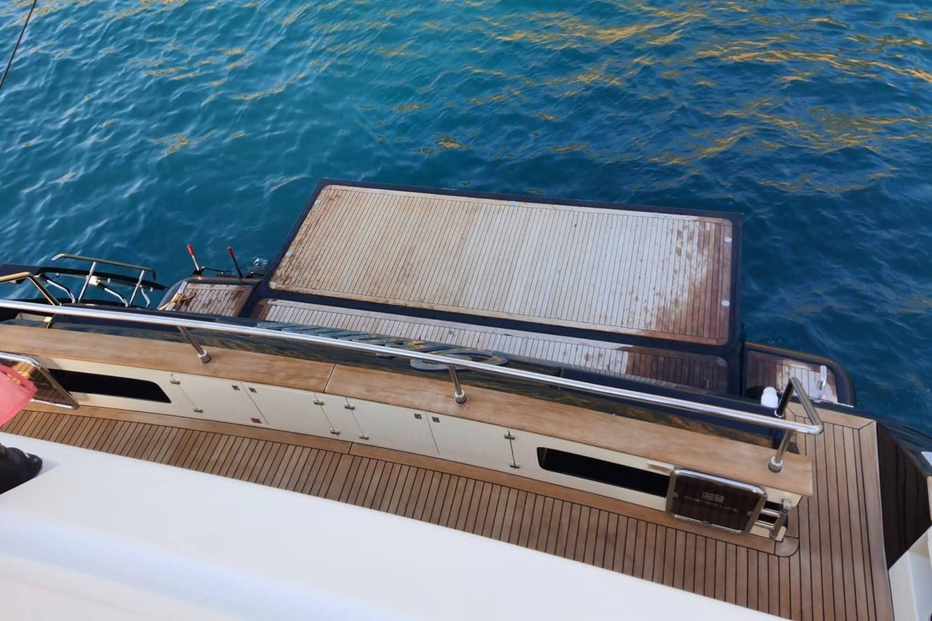a boat with a deck aboard OKAMI Yacht for Sale