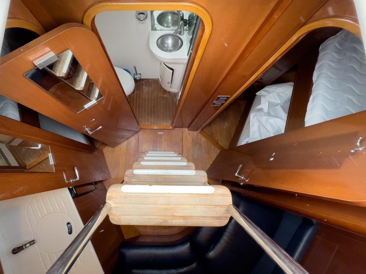 a room with a sink and a bed aboard TAMARA S Yacht for Sale