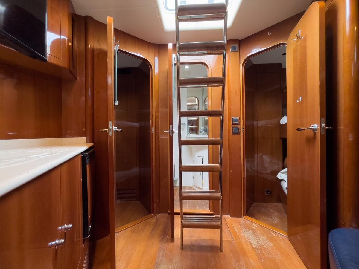 a room with a wood door and a mirror aboard TAMARA S Yacht for Sale