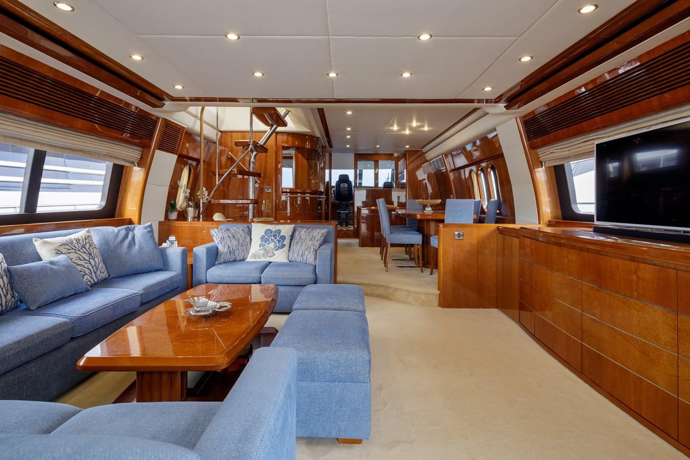 a living room with a couch and a coffee table aboard TAMARA S Yacht for Sale