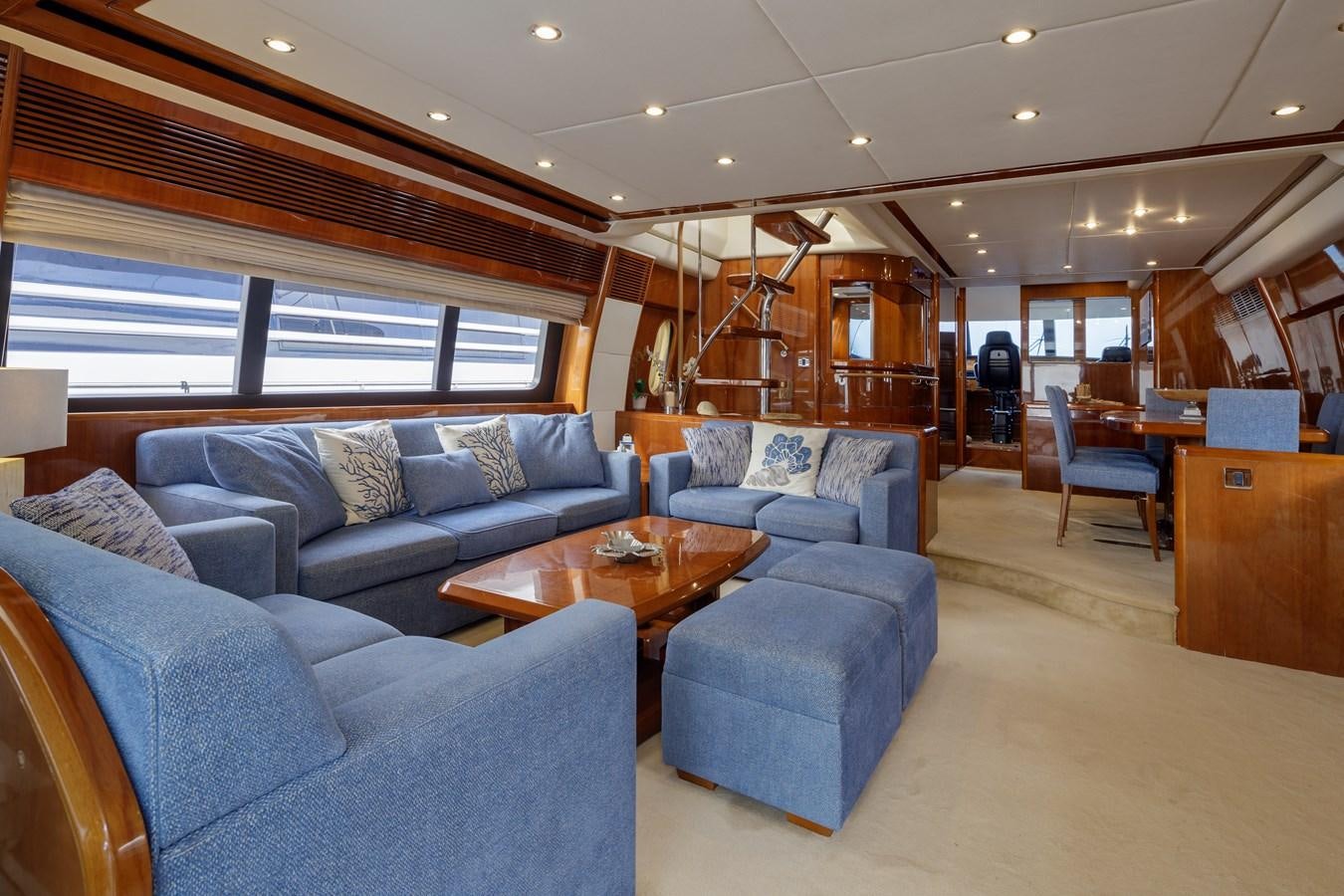 a living room with a large window aboard TAMARA S Yacht for Sale