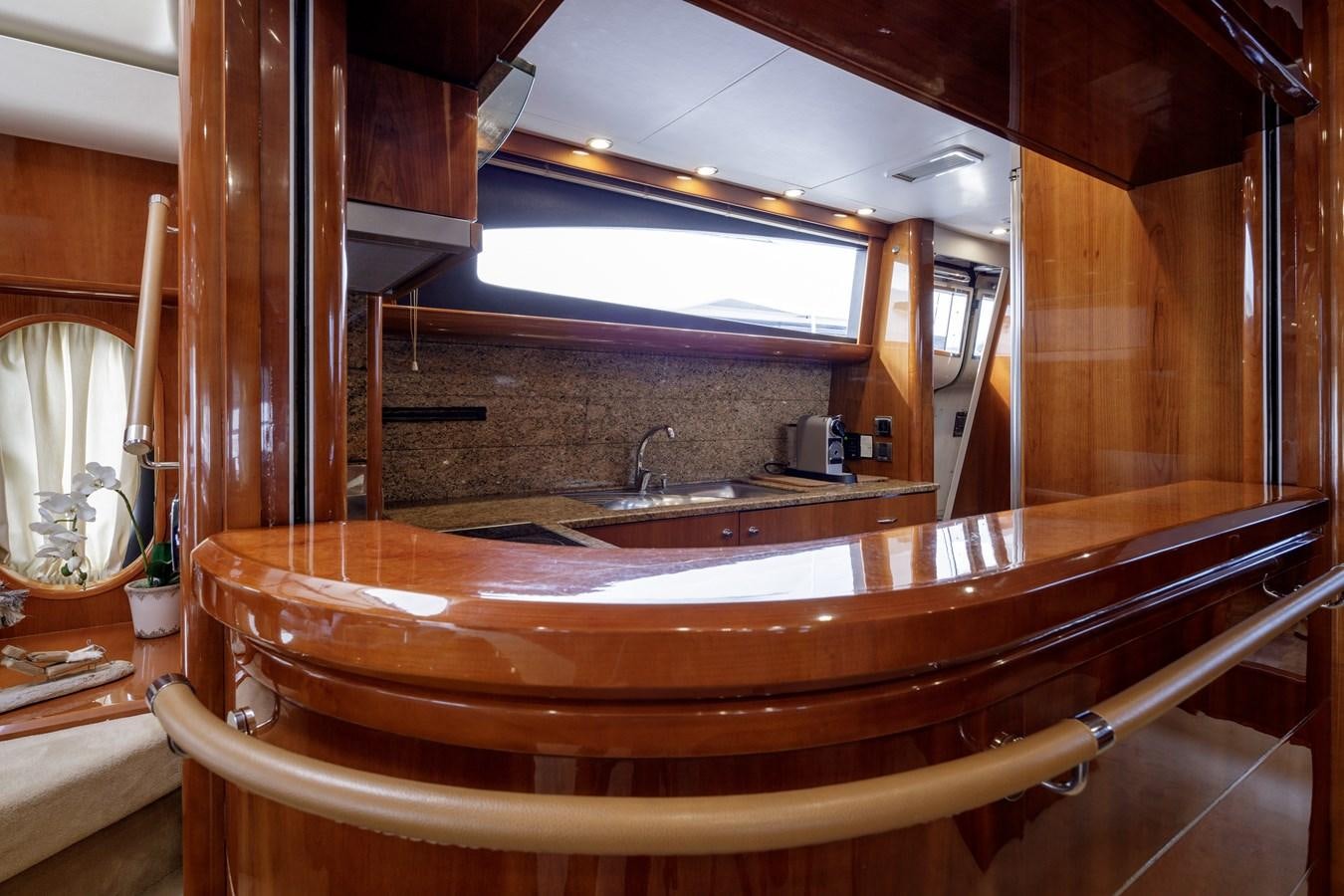 a kitchen with a large wooden counter aboard TAMARA S Yacht for Sale