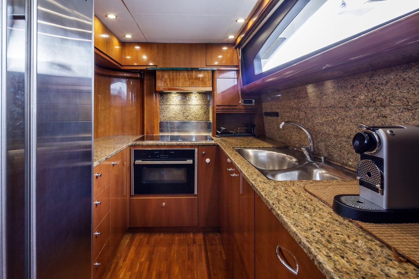 a kitchen with stainless steel appliances aboard TAMARA S Yacht for Sale