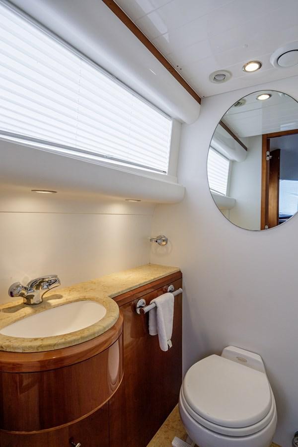a bathroom with a toilet and a sink aboard TAMARA S Yacht for Sale