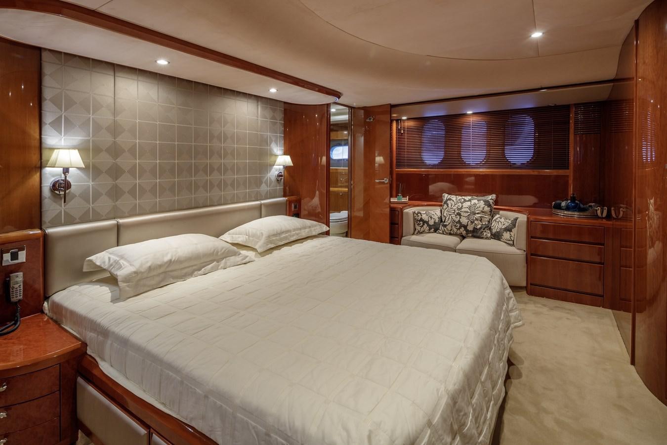a room with a bed and a desk aboard TAMARA S Yacht for Sale