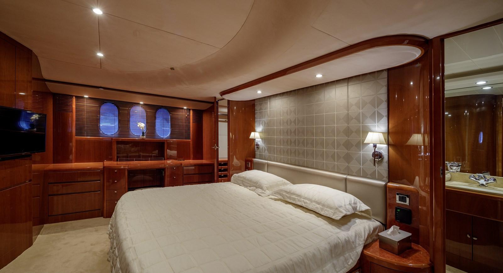 a room with a bed and a television aboard TAMARA S Yacht for Sale