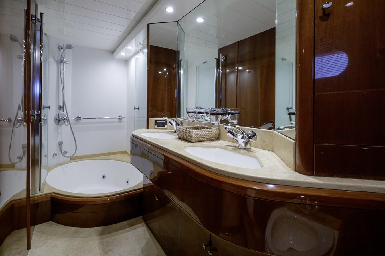a bathroom with a large mirror aboard TAMARA S Yacht for Sale