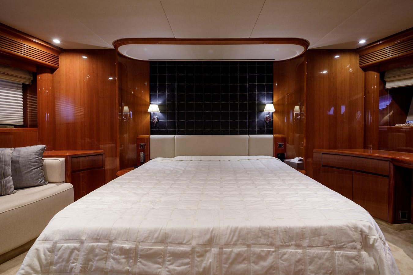 a bed with a white sheet aboard TAMARA S Yacht for Sale