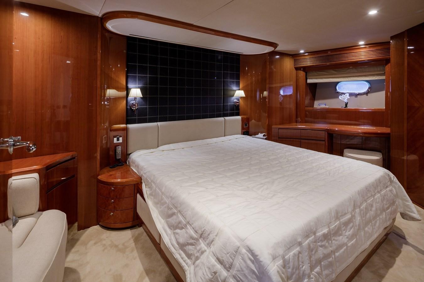 a bedroom with a bed and a desk aboard TAMARA S Yacht for Sale