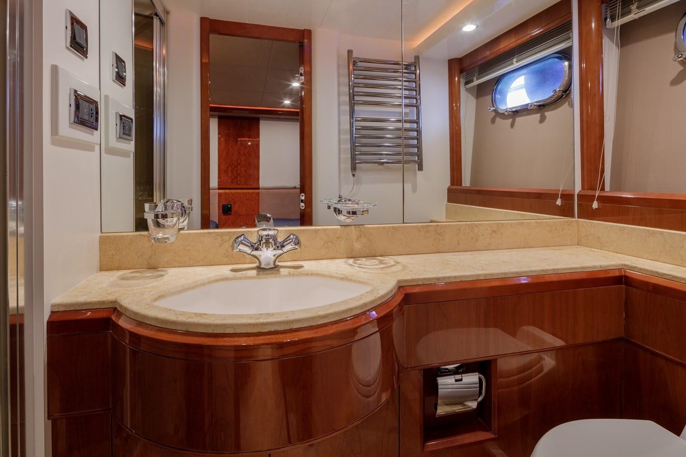 a bathroom with a large mirror aboard TAMARA S Yacht for Sale