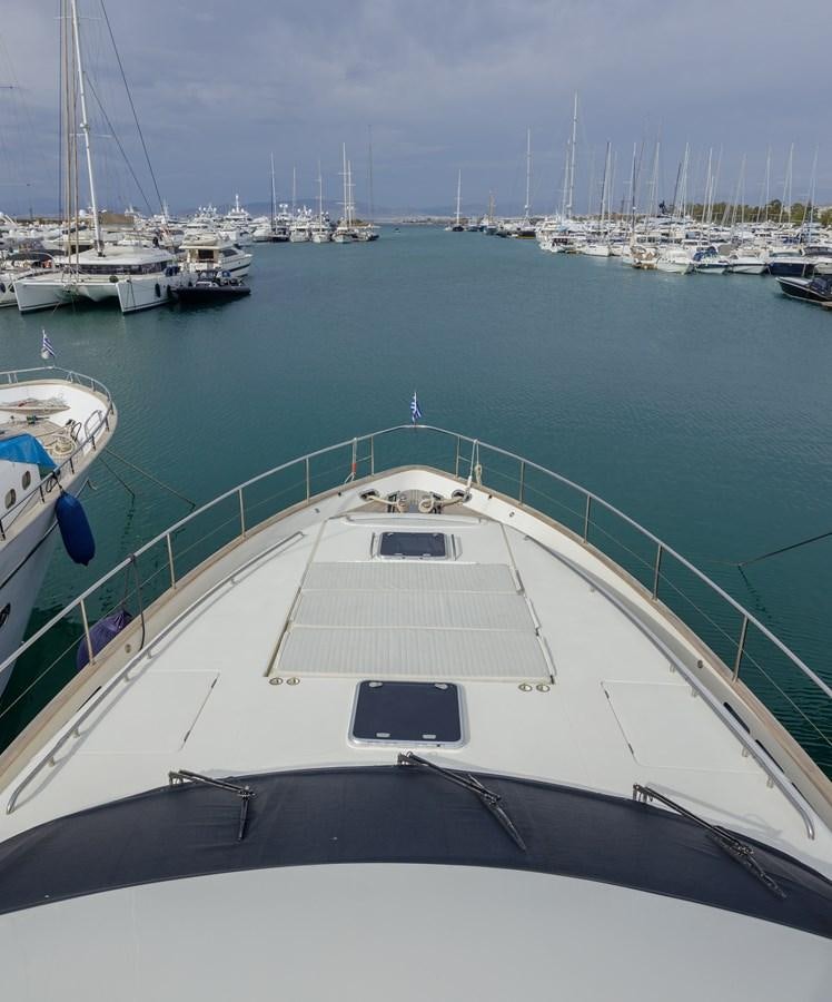 a large white boat in a harbor aboard TAMARA S Yacht for Sale