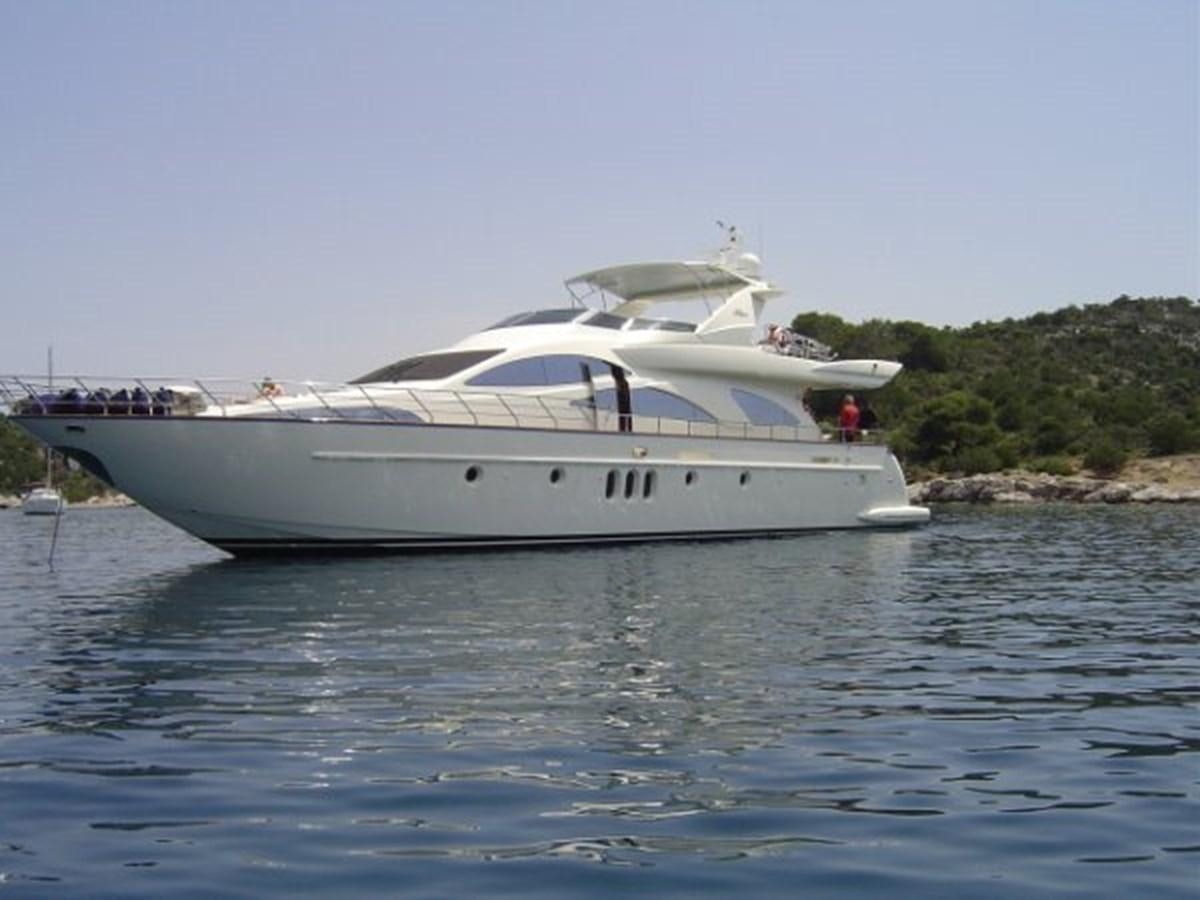 a white boat on the water aboard FREE SPIRIT Yacht for Sale