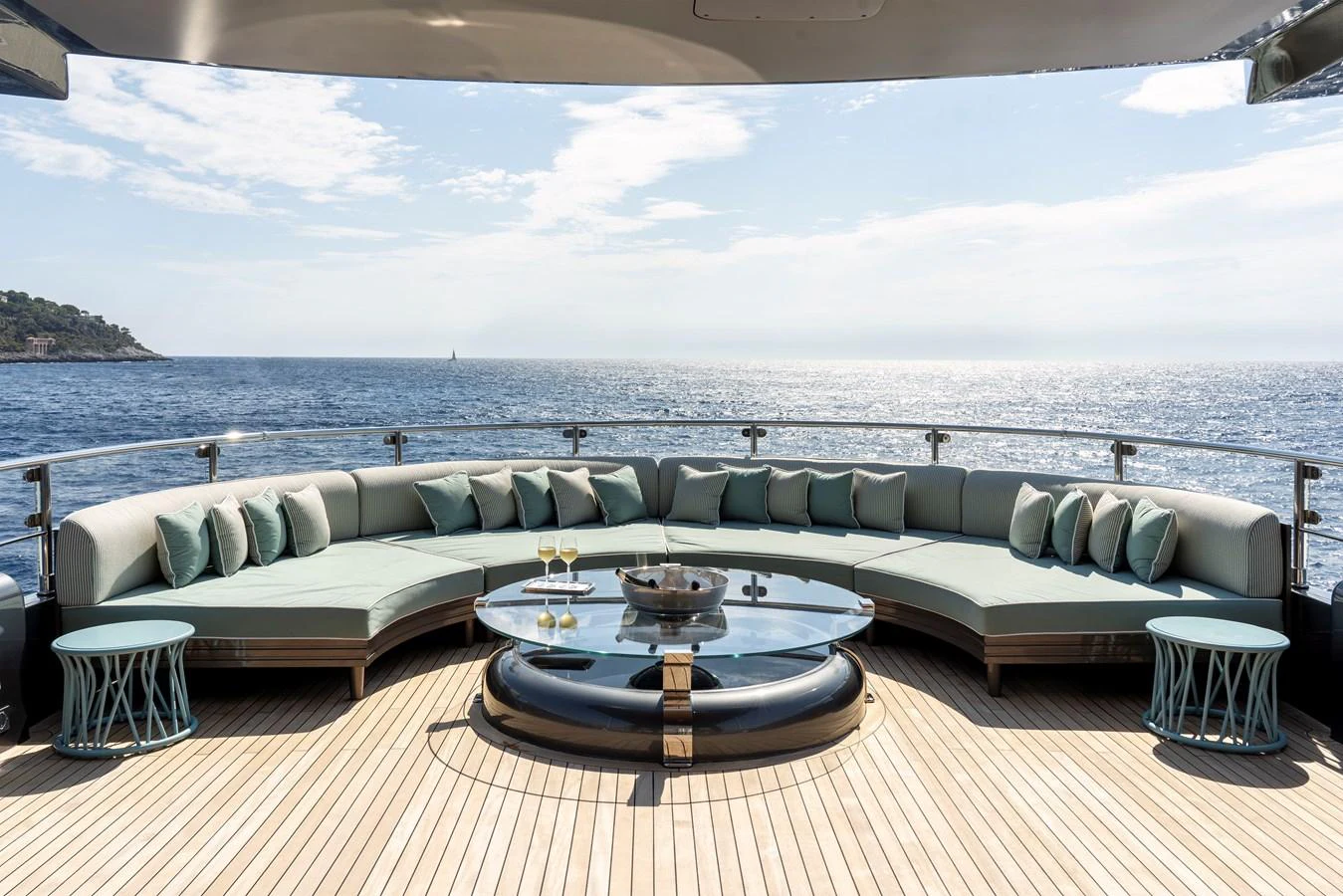 a couch and a table on a deck overlooking a body of water aboard MRS L Yacht for Sale