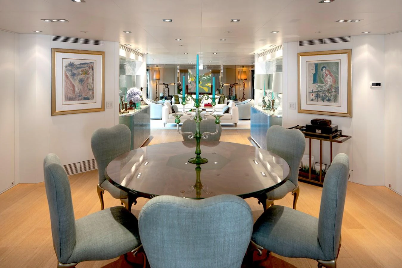 a room with a table chairs and a vase with flowers in it aboard MRS L Yacht for Sale