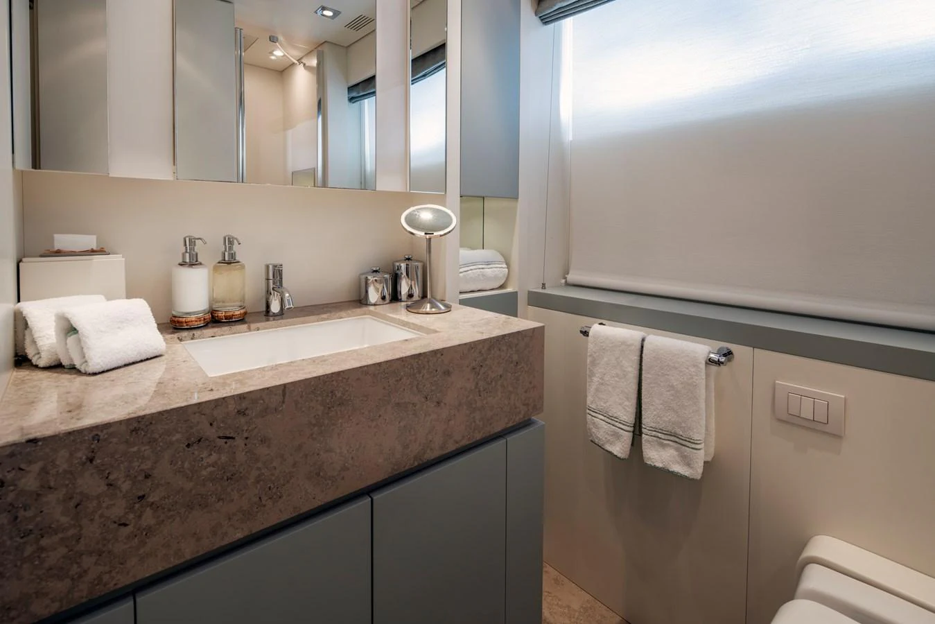 a bathroom with a countertop sink and mirror aboard MRS L Yacht for Sale