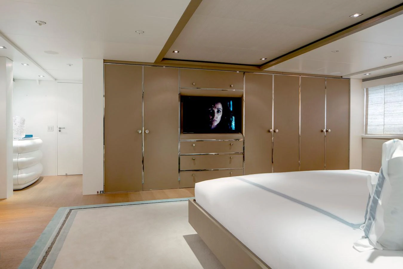 a room with a bed and a television aboard MRS L Yacht for Sale