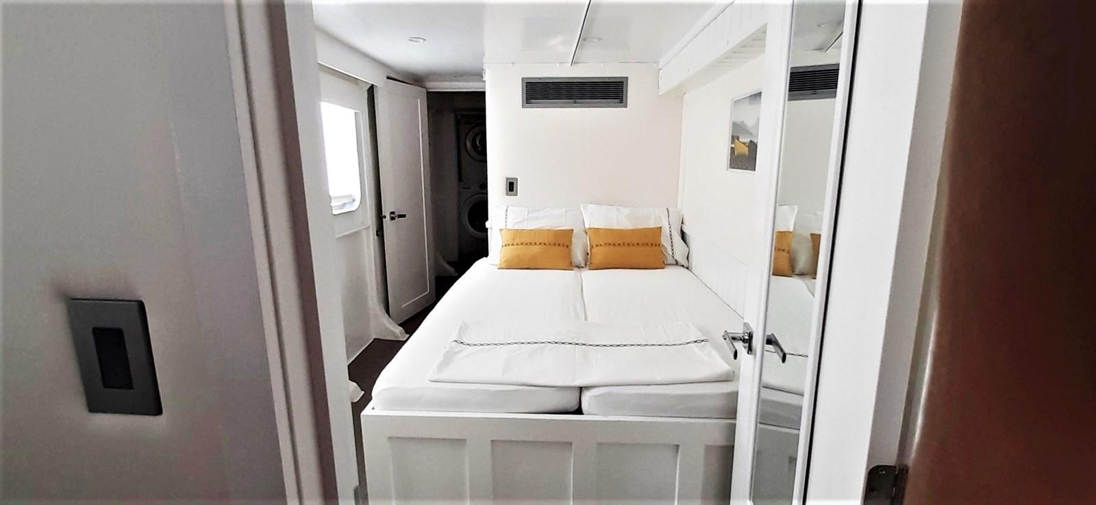 a bed in a room aboard BASILISK Yacht for Sale