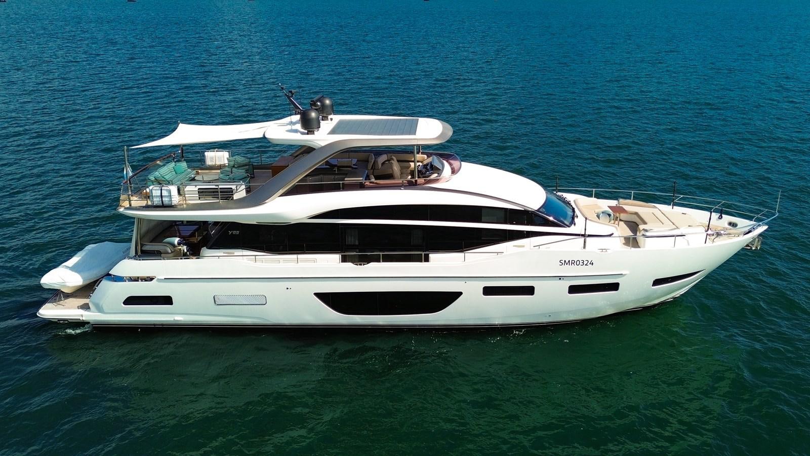 a white boat in the water aboard AHAVA Yacht for Sale