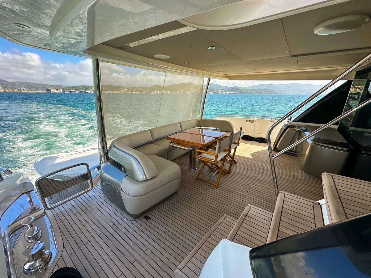 a boat with a table and chairs on it aboard AHAVA Yacht for Sale
