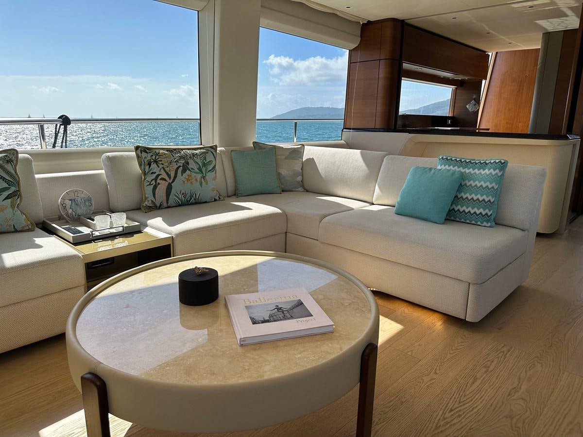 a living room with a couch and a table aboard AHAVA Yacht for Sale