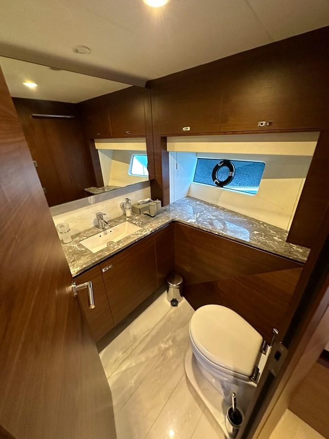 a bathroom with a large mirror aboard AHAVA Yacht for Sale