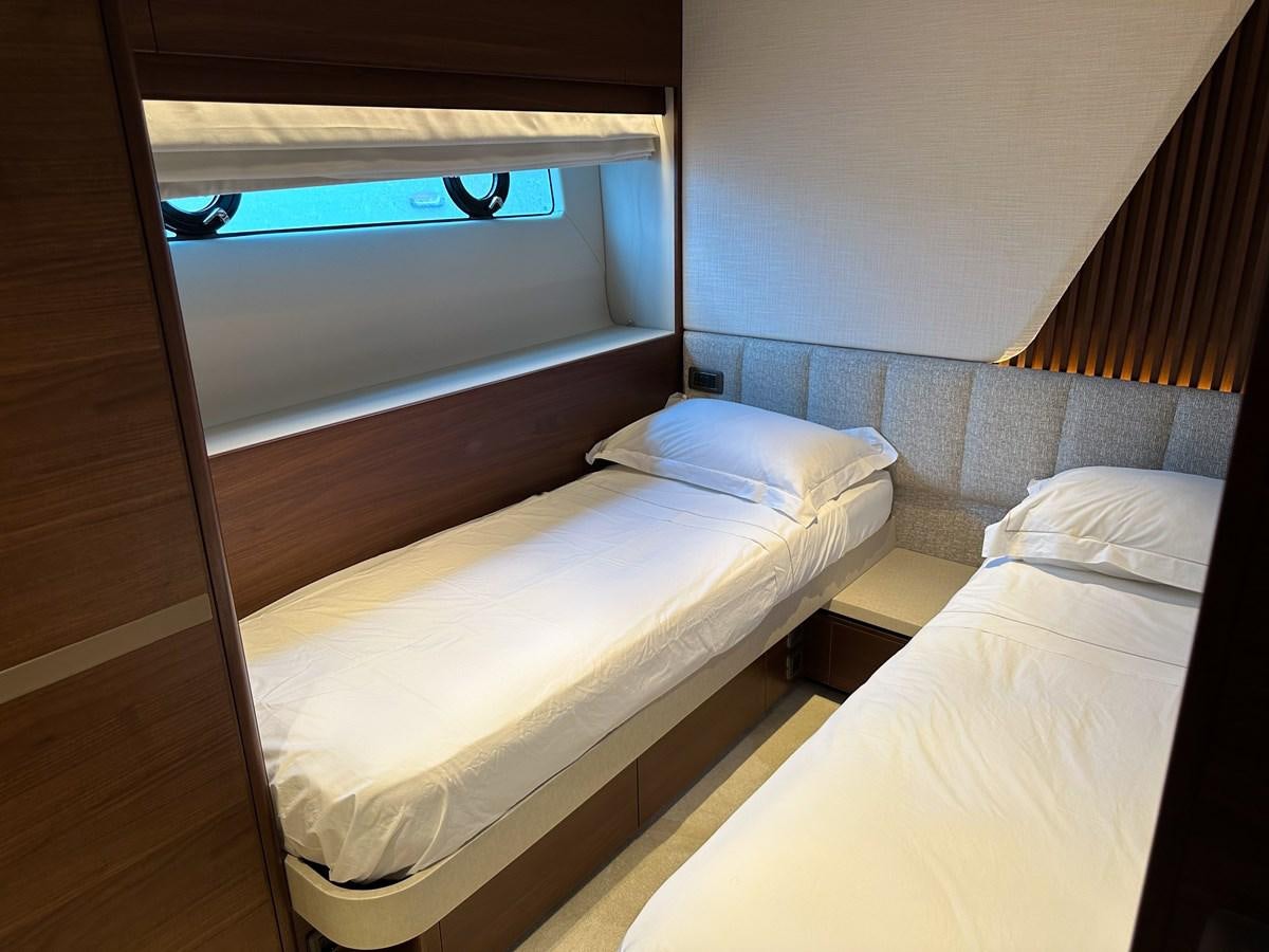 a room with two beds aboard AHAVA Yacht for Sale