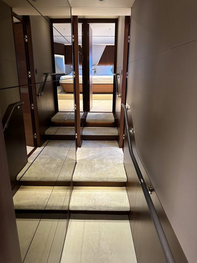 a hallway with a wood door aboard AHAVA Yacht for Sale