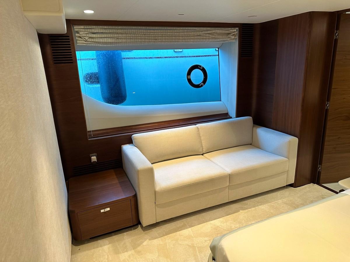 a couch and a television in a room aboard AHAVA Yacht for Sale