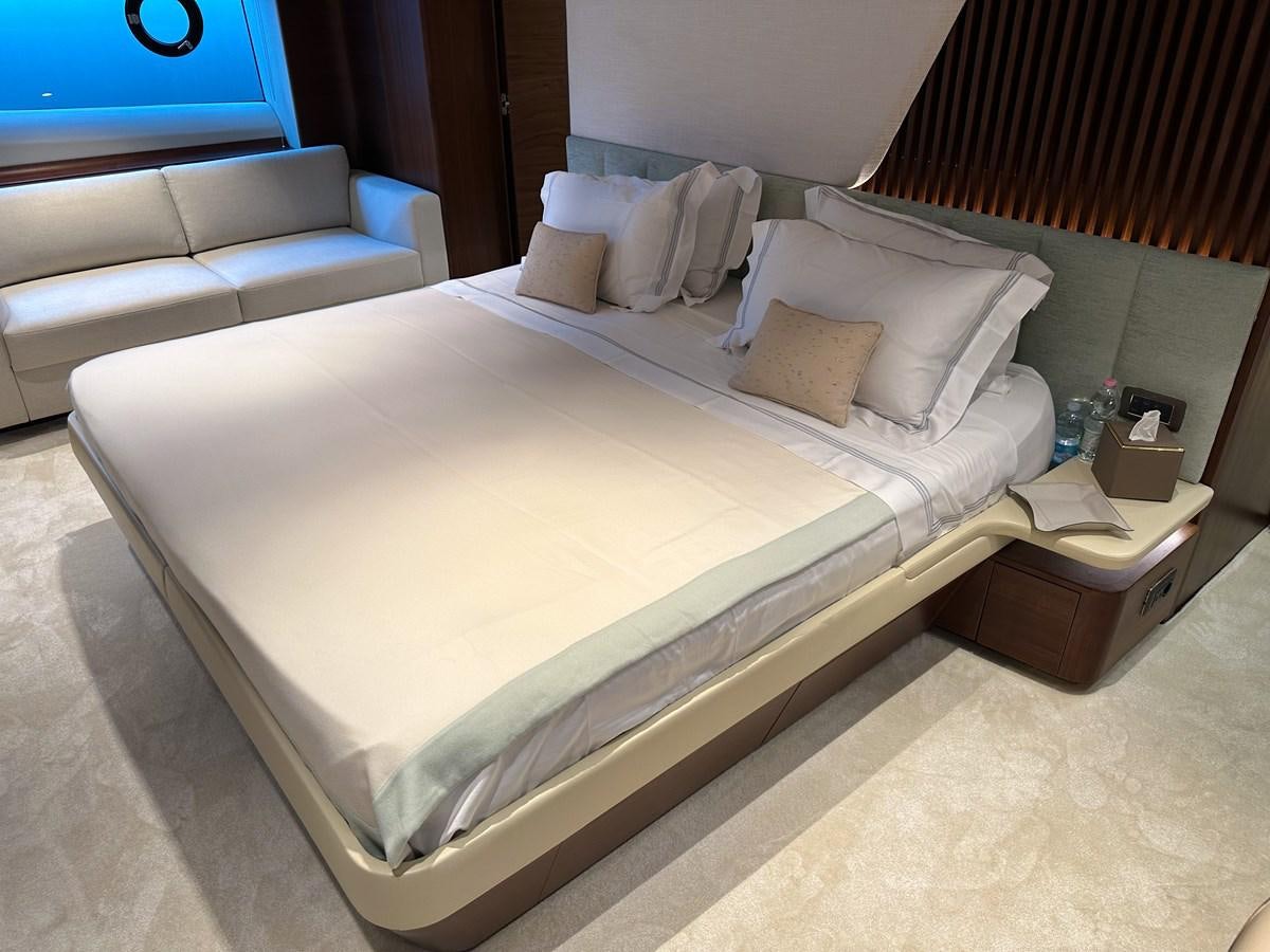 a bed with a white sheet aboard AHAVA Yacht for Sale