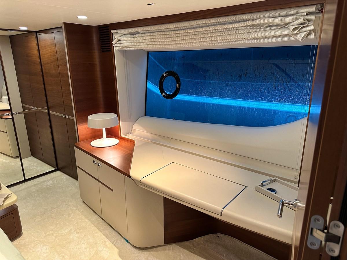a bathroom with a large blue shower curtain aboard AHAVA Yacht for Sale