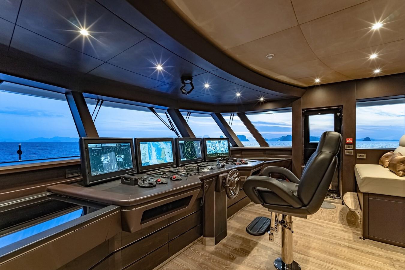 a room with many monitors and computers aboard SONG OF SONGS Yacht for Sale