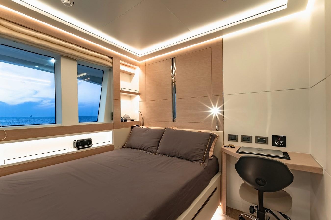 a bed in a room aboard SONG OF SONGS Yacht for Sale