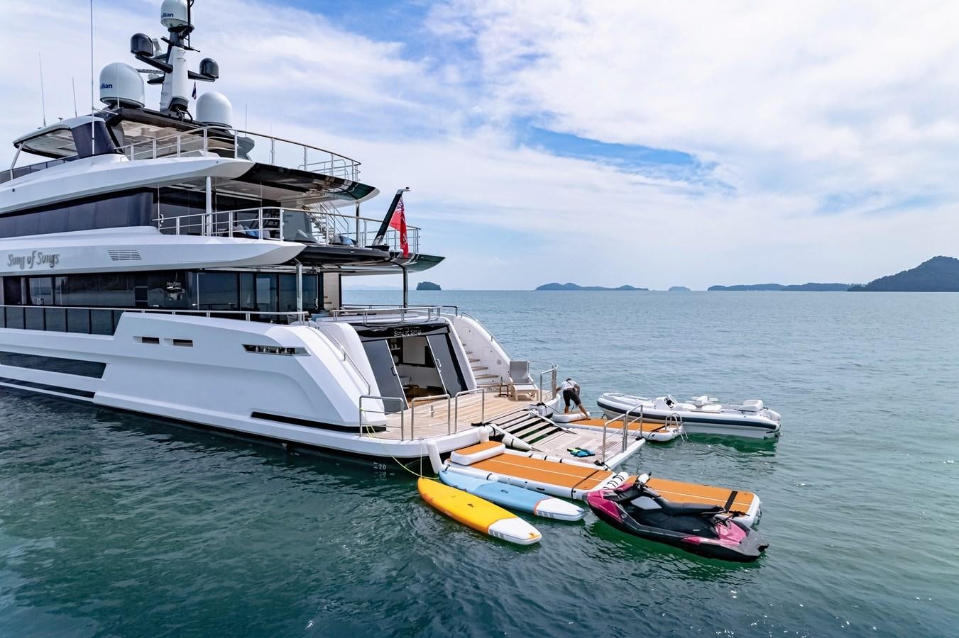 a boat and a boat in the water aboard SONG OF SONGS Yacht for Sale