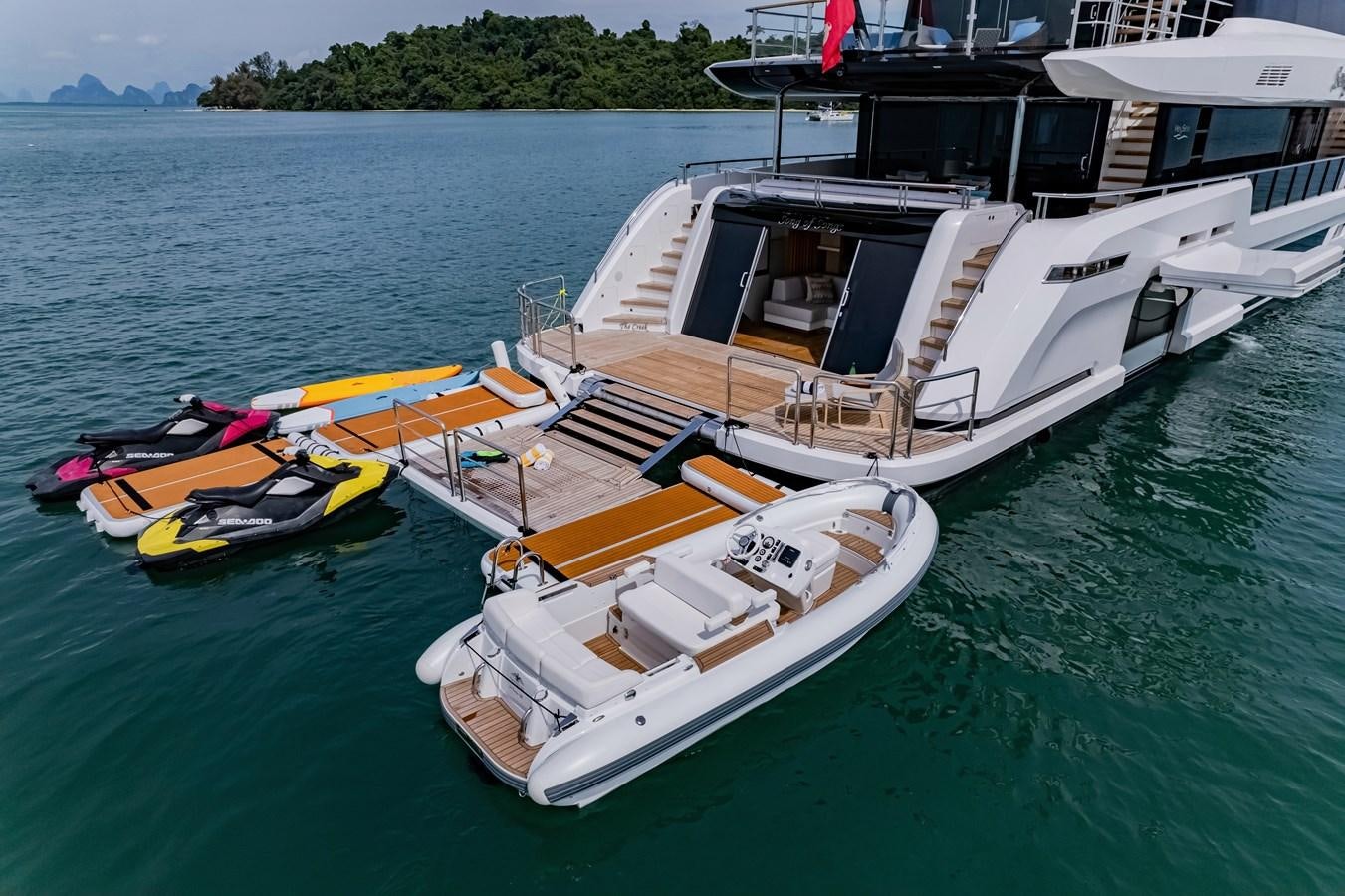 a boat docked at a pier aboard SONG OF SONGS Yacht for Sale