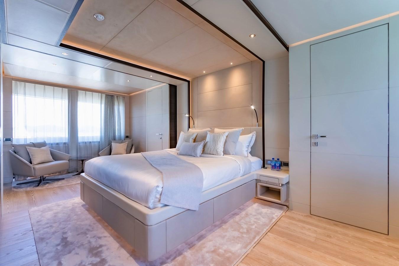 a large bedroom with a large bed aboard SONG OF SONGS Yacht for Sale