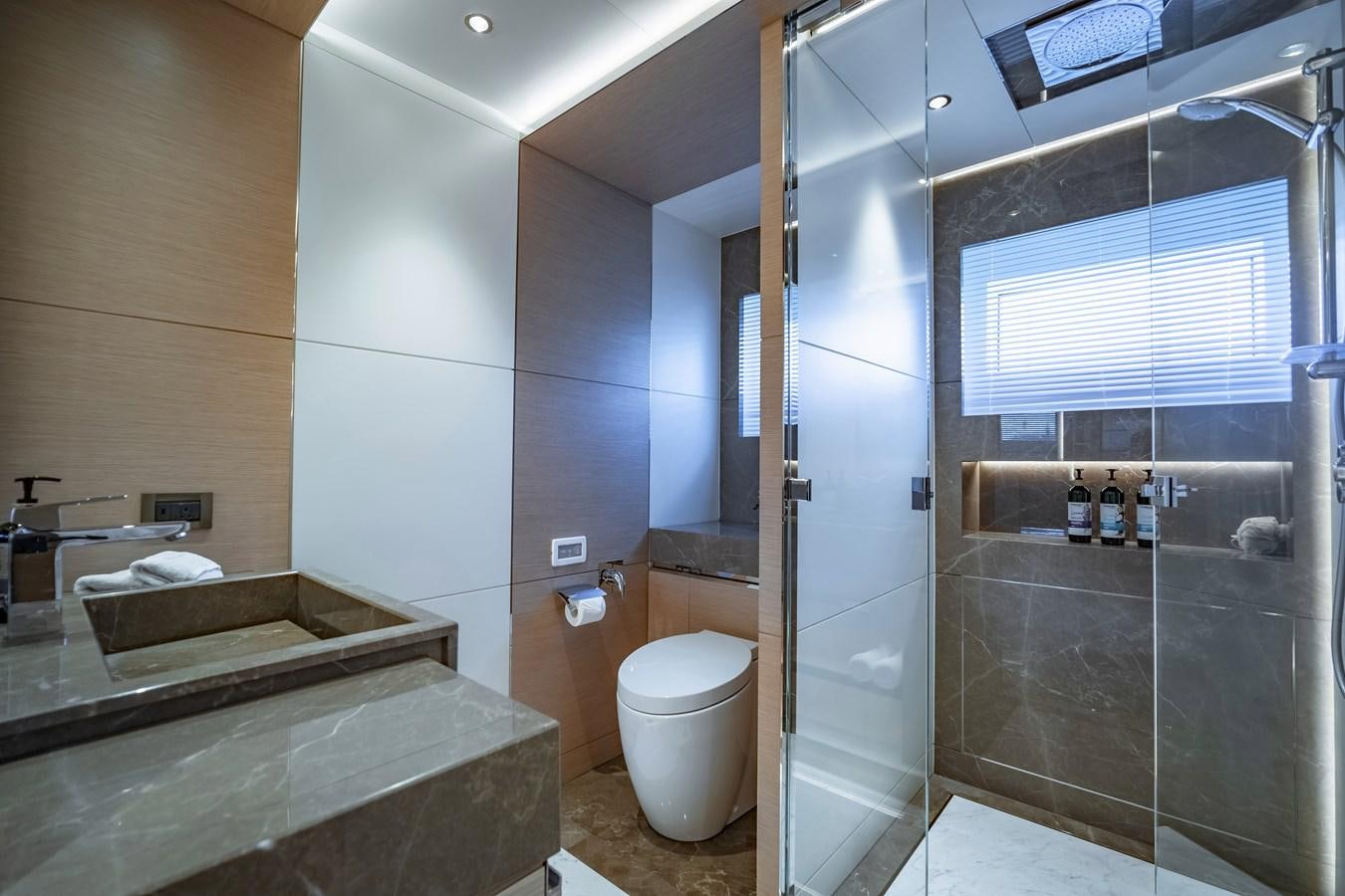 a bathroom with a glass shower aboard SONG OF SONGS Yacht for Sale