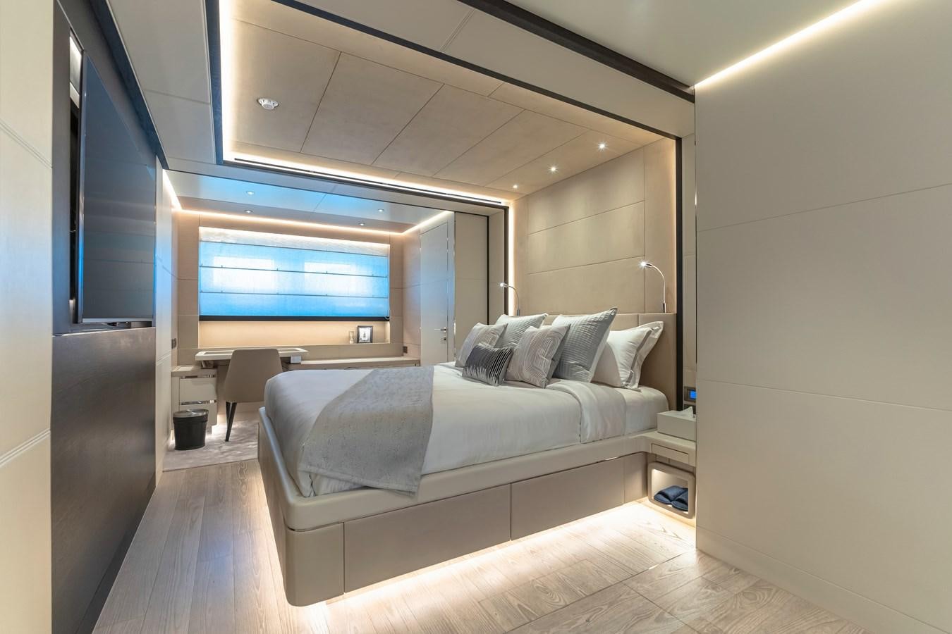 a room with a bed and a tv aboard SONG OF SONGS Yacht for Sale