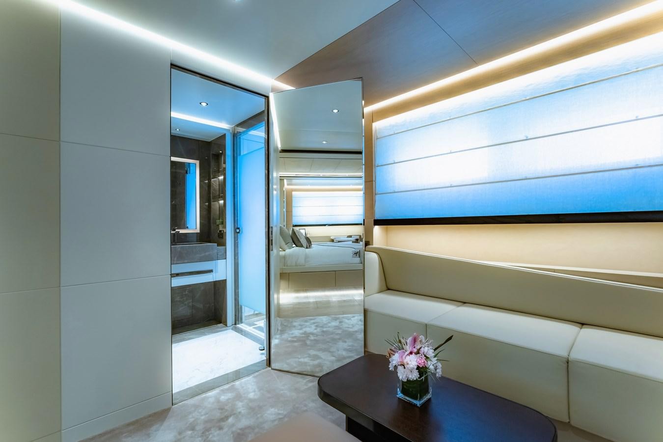 a room with a table and a couch aboard SONG OF SONGS Yacht for Sale