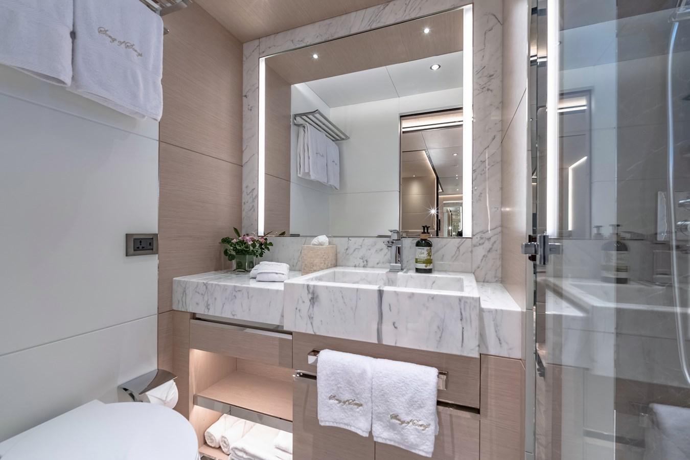 a bathroom with a large mirror aboard SONG OF SONGS Yacht for Sale