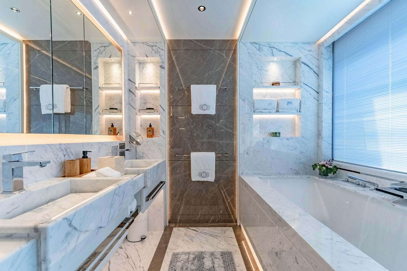 a bathroom with a tub sink and a shower unit aboard SONG OF SONGS Yacht for Sale