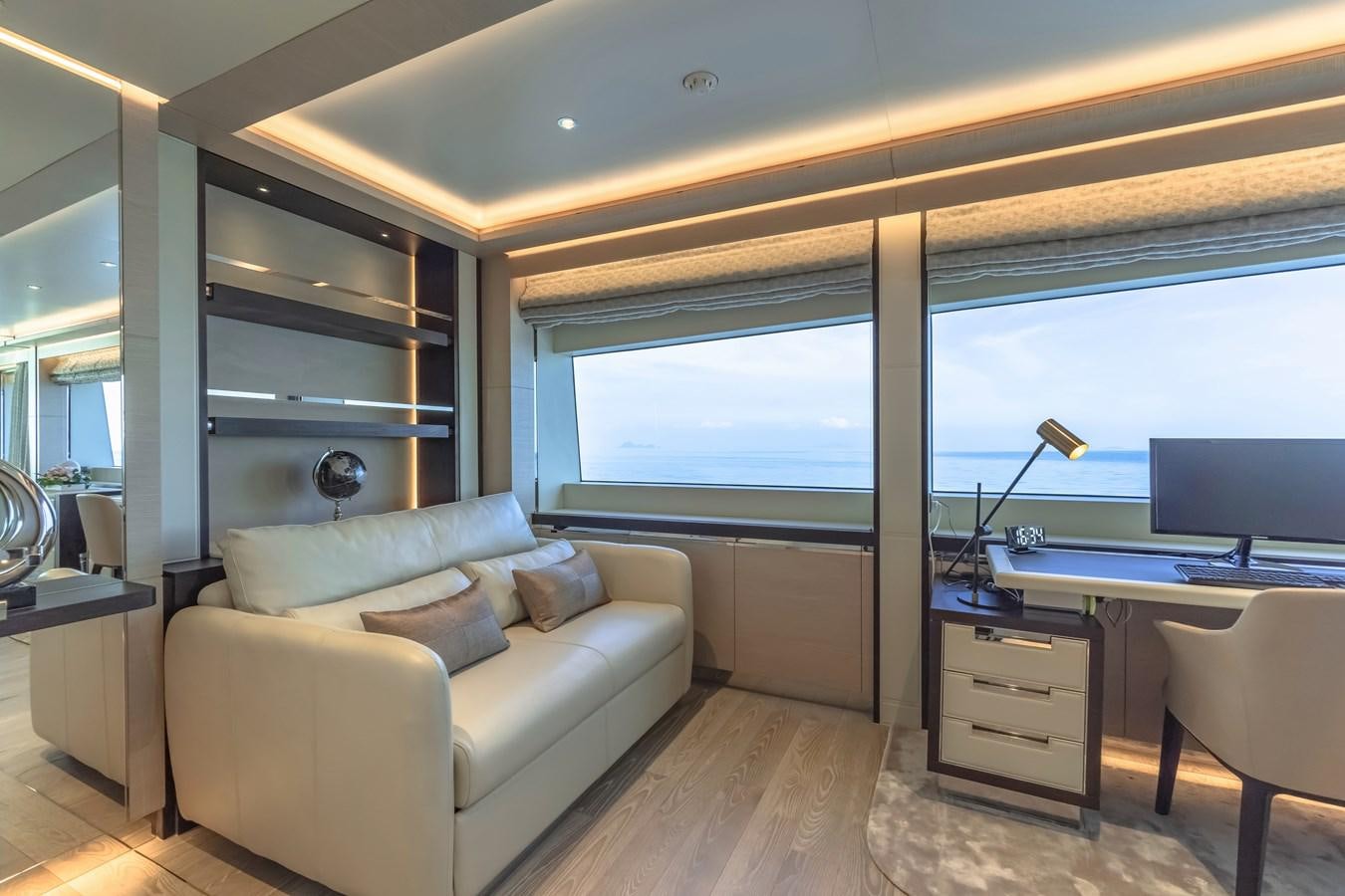 a living room with a couch and a tv aboard SONG OF SONGS Yacht for Sale