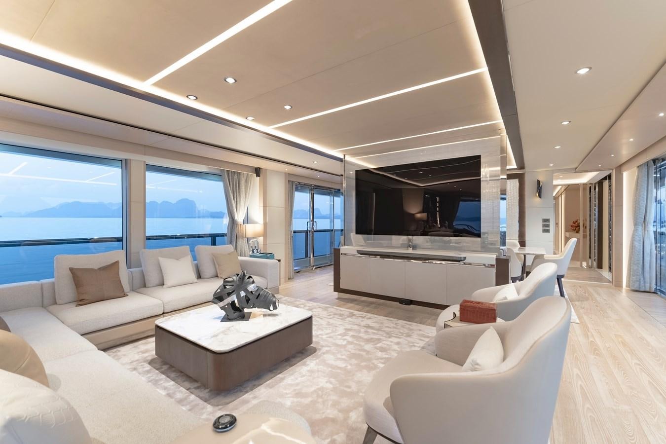 a living room with a large window aboard SONG OF SONGS Yacht for Sale