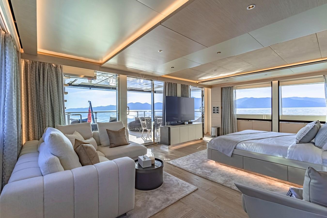 a room with a bed and a tv aboard SONG OF SONGS Yacht for Sale