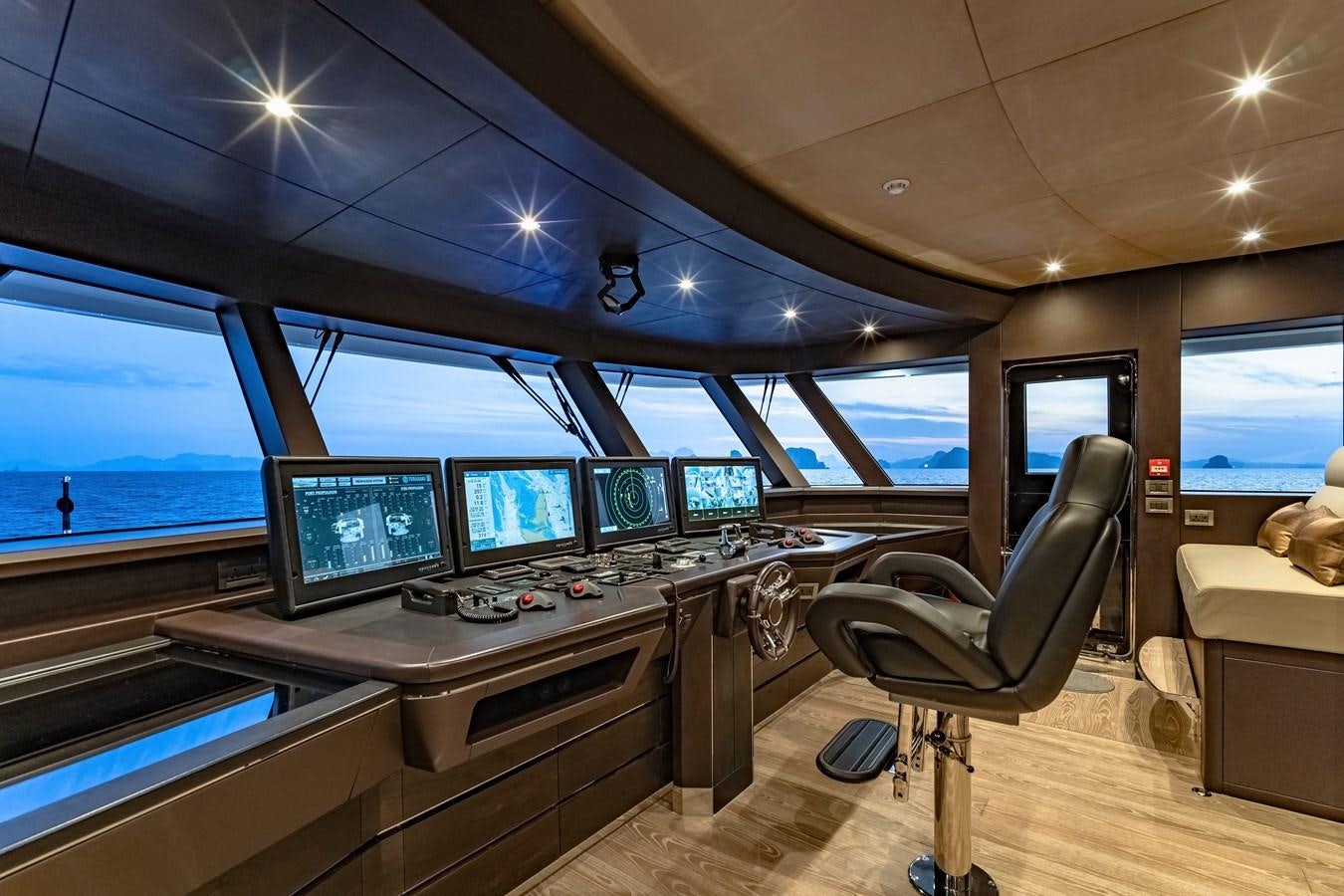 a room with many monitors and computers aboard SONG OF SONGS Yacht for Sale